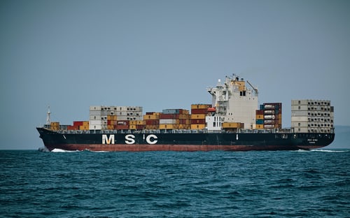 A logistics ship moving containers